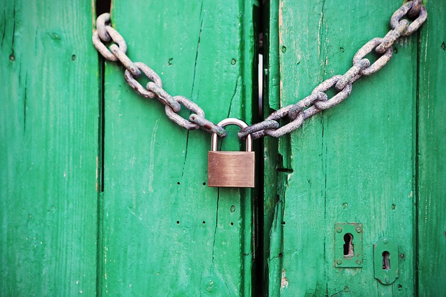 two chains linked together by a padlock.