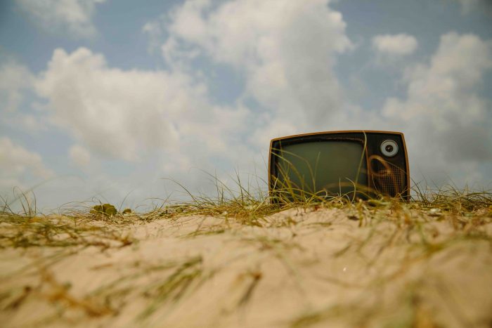 A TV. For some reason it's abandoned in a sand dune. It's a weird concept but it's a cute photo.