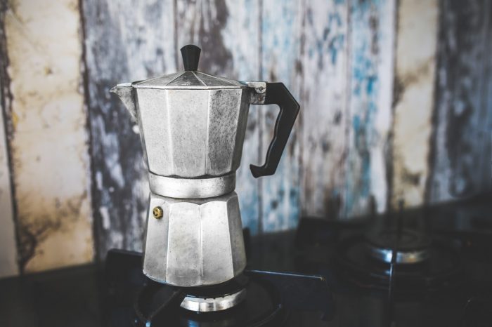 A coffee pot on a stove.