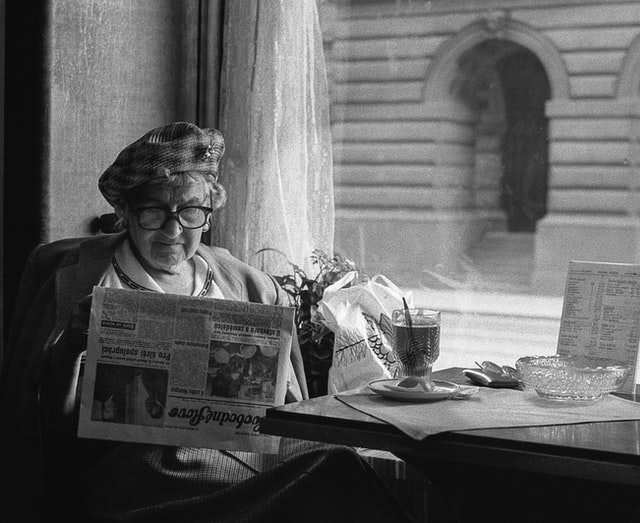 Woman reading a newspaper